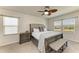 Serene main bedroom with large windows, a ceiling fan, and a spacious layout at 7822 110Th E Ave, Parrish, FL 34219