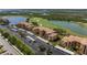 Stunning aerial view of community with scenic lakes and golf course views at 8205 Grand Estuary Trl # 101, Bradenton, FL 34212