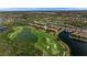Gorgeous aerial view capturing the beauty of the community's lake and golf course landscape at 8205 Grand Estuary Trl # 101, Bradenton, FL 34212