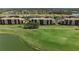 Beautiful aerial shot showcasing the community's lush green landscape and picturesque golf course at 8205 Grand Estuary Trl # 101, Bradenton, FL 34212