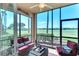 Relaxing screened lanai featuring comfortable seating and a serene view of the golf course at 8205 Grand Estuary Trl # 101, Bradenton, FL 34212