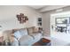 Comfortable living room with a sofa, and view to the dining room at 8205 Grand Estuary Trl # 101, Bradenton, FL 34212