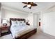 Spacious bedroom with wooden furniture, soft bedding, and an ensuite bathroom nearby at 8205 Grand Estuary Trl # 101, Bradenton, FL 34212