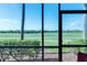 Enjoy beautiful views from the screened lanai, perfect for relaxing and entertaining amidst a green landscape at 8205 Grand Estuary Trl # 101, Bradenton, FL 34212