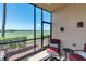 Cozy screened lanai with comfortable seating and scenic outdoor views for relaxing and enjoying the fresh air at 8205 Grand Estuary Trl # 101, Bradenton, FL 34212