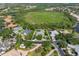 An aerial view of the property, showing the home and surrounding greenery at 8838 Bloomfield Blvd, Sarasota, FL 34238