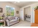 Comfortable bedroom featuring a large window with outdoor views and versatile living space at 8838 Bloomfield Blvd, Sarasota, FL 34238