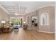 Bright living room with coffered ceiling and access to the pool area at 8838 Bloomfield Blvd, Sarasota, FL 34238