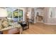 A cozy living room with hardwood floors and access to the outdoor patio at 8838 Bloomfield Blvd, Sarasota, FL 34238