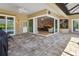 Outdoor patio with brick pavers leading into the living room at 8838 Bloomfield Blvd, Sarasota, FL 34238