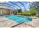Screened in pool and hot tub with brick pavers at 8838 Bloomfield Blvd, Sarasota, FL 34238
