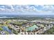 Wide aerial view capturing the stunning neighborhood with multiple lakes and lush green spaces at 8995 Founders Cir, Palmetto, FL 34221