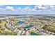Scenic aerial view of the community featuring multiple lakes, a golf course, and beautiful homes at 8995 Founders Cir, Palmetto, FL 34221