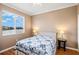 Cozy bedroom with a white bed frame, lake views, and two side tables with decorative lamps at 8995 Founders Cir, Palmetto, FL 34221