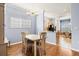 Cozy dining room bathed in natural light with wood floors at 8995 Founders Cir, Palmetto, FL 34221