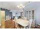 Dining room with table, chairs and a view to the living room at 8995 Founders Cir, Palmetto, FL 34221