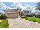 Lovely home featuring a well-manicured lawn and a welcoming two-car garage at 8995 Founders Cir, Palmetto, FL 34221
