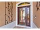 Elegant front door with decorative glass and stylish hardware at 8995 Founders Cir, Palmetto, FL 34221