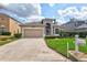 Charming home featuring a well-manicured lawn and a welcoming two-car garage at 8995 Founders Cir, Palmetto, FL 34221