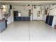 This garage is spacious and well-organized, featuring custom cabinets and a durable epoxy floor at 8995 Founders Cir, Palmetto, FL 34221