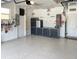 This garage is organized with a custom cabinet system, an epoxy floor, and ample lighting at 8995 Founders Cir, Palmetto, FL 34221