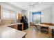 Bright eat-in kitchen featuring tile flooring, wood cabinets, and black appliances at 8995 Founders Cir, Palmetto, FL 34221
