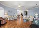 Spacious living room with couches, coffee table and wood floors at 8995 Founders Cir, Palmetto, FL 34221