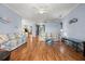 Bright living room with hardwood floors and comfortable floral sofas at 8995 Founders Cir, Palmetto, FL 34221