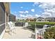 Enjoy outdoor dining on this patio with views of the well-manicured lawn and neighboring homes at 8995 Founders Cir, Palmetto, FL 34221