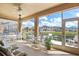 Relax on this screened lanai with ample seating and lovely views of the surrounding community at 8995 Founders Cir, Palmetto, FL 34221