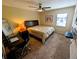 Comfortable bedroom boasts a ceiling fan and window for natural light at 105 S Obrien St # 213, Tampa, FL 33609