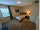 Bedroom with carpet, window, ceiling fan and closet at 105 S Obrien St # 213, Tampa, FL 33609