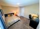 Bedroom with a bed, desk, and bright natural light from the window at 105 S Obrien St # 213, Tampa, FL 33609