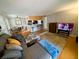 Open-concept living space with a view of the kitchen and breakfast bar at 105 S Obrien St # 213, Tampa, FL 33609