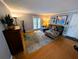 Bright living area featuring a large sectional sofa, modern rug, and sliding doors at 105 S Obrien St # 213, Tampa, FL 33609