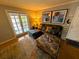 Cozy living room showcasing a sectional sofa, decorative pillows, and stylish art at 105 S Obrien St # 213, Tampa, FL 33609