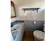 Simple bathroom with a white sink, toilet, and a small amount of tile at 112 Park Ter, Venice, FL 34285