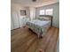 Charming bedroom with a patterned bedspread, neutral walls, and carpet floors at 112 Park Ter, Venice, FL 34285
