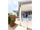 Charming home with covered porch and manicured garden area, creating a serene outdoor space at 112 Park Ter, Venice, FL 34285