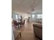 Open concept living and dining area with hardwood floors and plenty of natural light at 112 Park Ter, Venice, FL 34285
