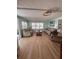 Cozy living room with two sofas, a recliner, light wood floors and a ceiling fan at 112 Park Ter, Venice, FL 34285