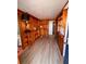 Office with wood paneled walls, shelves and laminate floors at 112 Park Ter, Venice, FL 34285