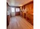An office with wood paneling and laminate floors at 112 Park Ter, Venice, FL 34285