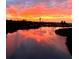 Breathtaking sunset view over the waterway, reflecting vibrant colors on the calm water at 112 Park Ter, Venice, FL 34285