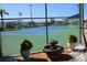Community tennis courts, enclosed by a chain link fence and landscaping at 112 Park Ter, Venice, FL 34285