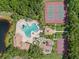 Aerial view showcasing the community pool, tennis courts, playground, and recreational areas at 11713 Goldenrod Ave, Bradenton, FL 34212