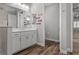 Bathroom featuring a tiled shower, a sink, and direct access to the adjoining bedroom at 11713 Goldenrod Ave, Bradenton, FL 34212