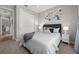Bedroom features a comfy bed, ample natural light, and cool-toned decor for a serene, inviting space at 11713 Goldenrod Ave, Bradenton, FL 34212