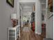 Inviting entryway with elegant decor, showcasing hardwood floors and a seamless transition into the living spaces at 11713 Goldenrod Ave, Bradenton, FL 34212
