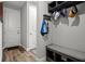 Inviting entryway with coat rack, storage bench, and 'Home Sweet Home' decor providing organization and style at 11713 Goldenrod Ave, Bradenton, FL 34212
